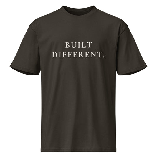 Product mockup of a vintage black t-shirt with 'BUILT DIFFERENT' text on a white background